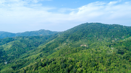 Naklejka na ściany i meble Scenery of the mountains in tropical rainforest Abundant nature in asia thailand Aerial view Drone shot