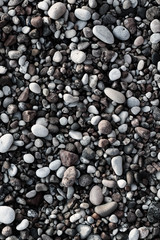 Fototapeta na wymiar smooth colorful pebbles on the beach