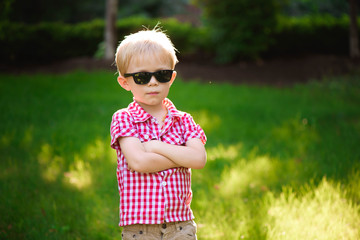 funny little boy in sunglasses. Child boy in sunglasses