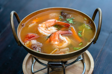 Tom yam kung or Tom yum, Tom yam is a spicy clear soup typical in Thailand. Popular food in Thailand