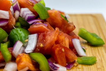 Colourful chopped vegetables on a wooden cutting board. Calgary, Alberta, Canada