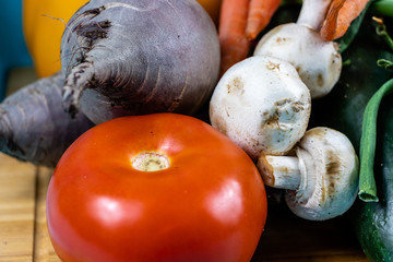 Colourful assorted raw vegetables on a wooden cutting board. Calgary, Alberta, Canada