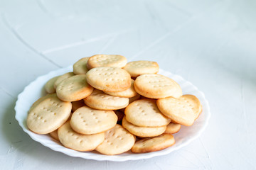 Sweet healthy homemade cookies on a white plate isolated, picture with space for text