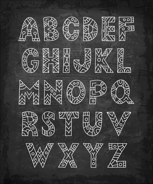 Tribal alphabet on chalk board background. Doodle letters in ethnic style. Vector illustration. Zentangle