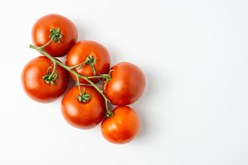 Fresh organic red tomatoes on white background. Selective focus.