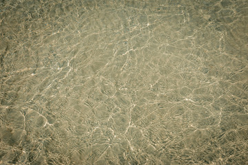 droped sungrass and small waves lapped the beach