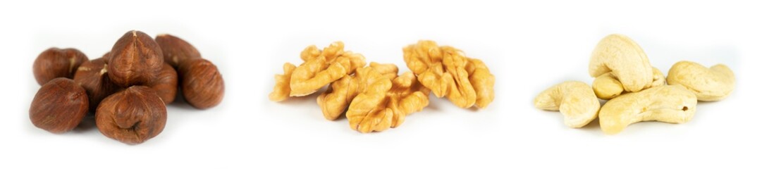 Various Nuts in bowls on white background, top view, copy space. Nuts assortment frame - hazelnuts, walnuts, cashews seeds.