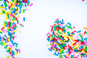 Colorful candy sprinkles close up for birthday cake on white background