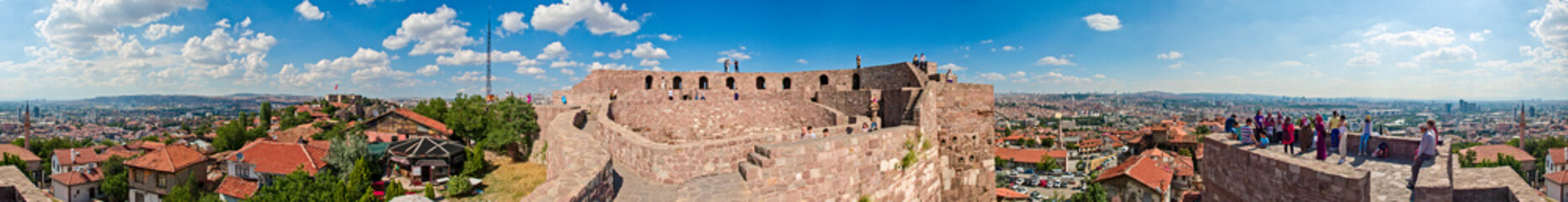 Fototapeta na wymiar Panoramic view of Ankara Castle (Kalesi). It is a fortification from the late antique / early medieval era in Ankara, Turkey. 360 degree view of the capital of Turkey. Tourists on the walls of the man