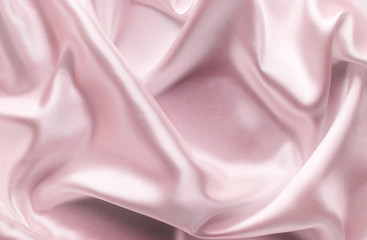 Fototapeta premium delicate pink satin fabric with large folds