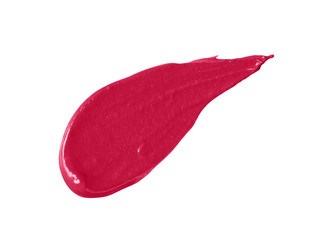 Red lipstick smear smudge swatch isolated on white background. Cream makeup texture. Bright color cosmetic product stroke swipe sample