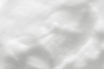Obraz premium Foam texture background. Cosmetic soap, cleanser, shampoo bubbles. Macro, top view