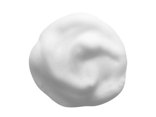White cleanser foam isolated on white background. Cosmetic soap texture with bubbles. Macro, top...