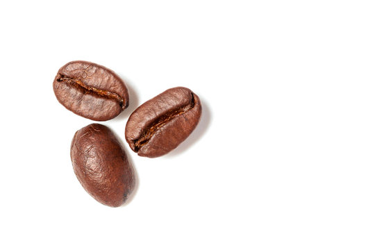 A Spread Coffee Beans Isolated On White Background And Copy Space