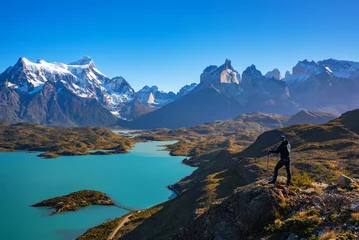 Wall murals Cordillera Paine Hiker at mirador condor enjoying amazing view of Los Cuernos rocks and Lake Pehoe in Torres del Paine national park, Patagonia, Chile