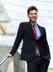 Young businessman on some stairs outdoor