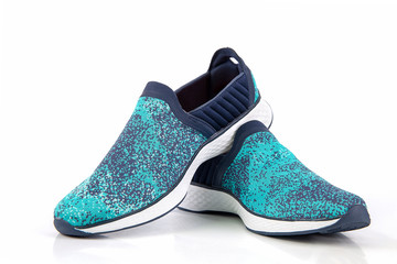 Green sneakers or sport running shoe isolated on a white background