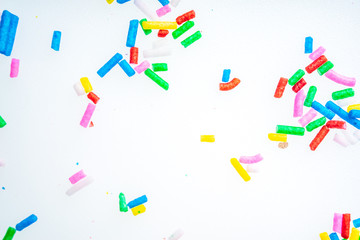 Colorful candy sprinkles close up for birthday cake on white background