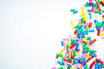 Colorful candy sprinkles close up for birthday cake on white background