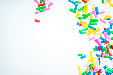 Colorful candy sprinkles close up for birthday cake on white background