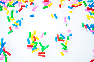 Colorful candy sprinkles close up for birthday cake on white background