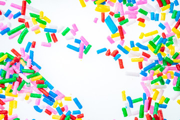 Colorful candy sprinkles close up for birthday cake on white background