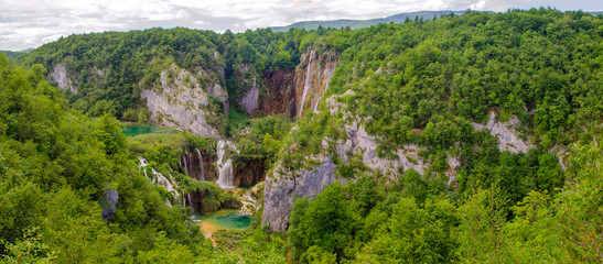 Fototapeta na wymiar Luxurious and tumultuous waterfalls of Plitvice Lakes, Croatia