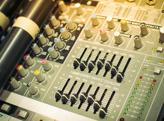 Sound equalizer mixing. Professional studio equipment for sound mixing. Music studio image. Close up and selective focus.