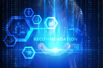 The concept of business, technology, the Internet and the network. A young entrepreneur working on a virtual screen of the future and sees the inscription: Recommendation