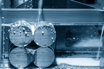 The band saw machine cutting the metal rod. The metal cutting process by band saw machine with...