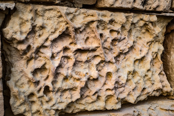 limestone bricks eroded and cracked