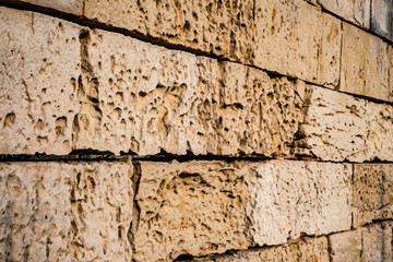 limestone bricks eroded and cracked