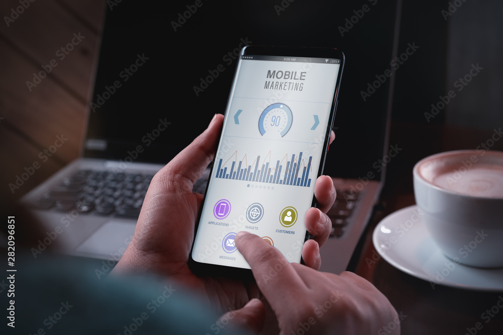 Poster mobile marketing and customer data analytics concept. close up two hand holding smart phone with mob