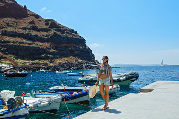 Young woman walking on the pier