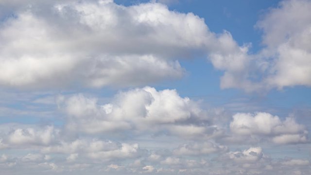 Timelapse of white clouds on a blue sky