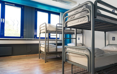 Hostel interior, bunk beds and linen, nobody