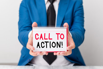 Handwriting text Call To Action. Conceptual photo exhortation do something in order achieve aim with problem Man holds empty paper with copy space in front of him Copy Space