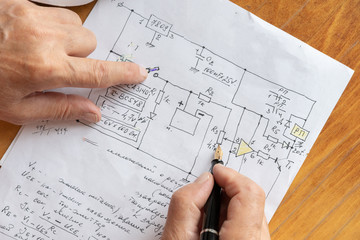 macro view of engineer planing the electrical circuit on paper