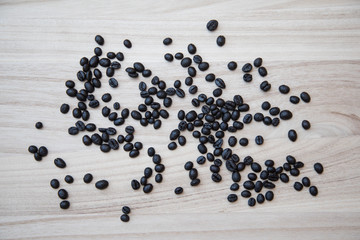 Coffe beans on a natural wooden background