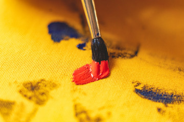 drawing with a brush on a t-shirt, personal unique clothes  design concept