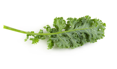 Fresh organic green kale leaves isolated over white background