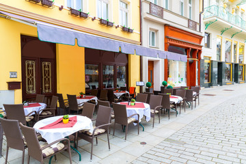 Outdoor cafe on cobblestone street, Karlovy Vary