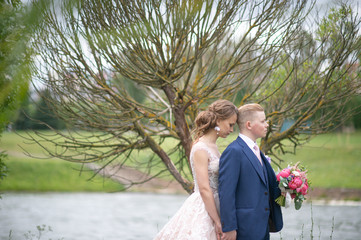 Beautiful wedding couple posing outdoor