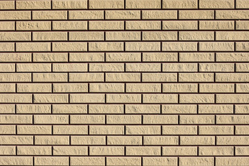 Background freshly laid clean brick wall in a new building, texture