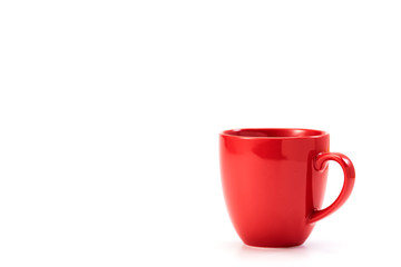 red ceramic mug on white background