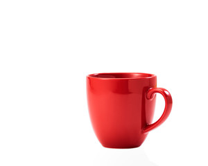 red ceramic mug on white background