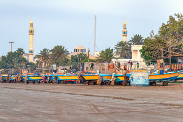 05/11/2019 Bandar Abbas, Hormozgan Province, Iran, many colorful fishing boats on the Persian Gulf coast stand at dawn and wait for the beginning of the working day.