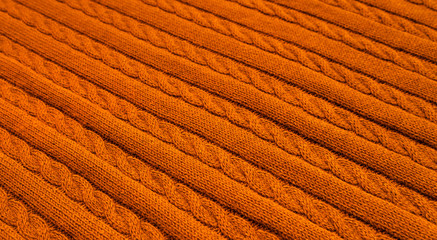 Background made of knitted ornament texture. Macro photo.