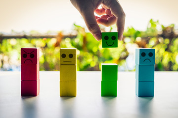 Customer choosing rating with happy green block icon on nature background, Customer satisfaction survey concept