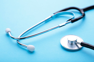 Medical stethoscope on a blue background. Health care concept